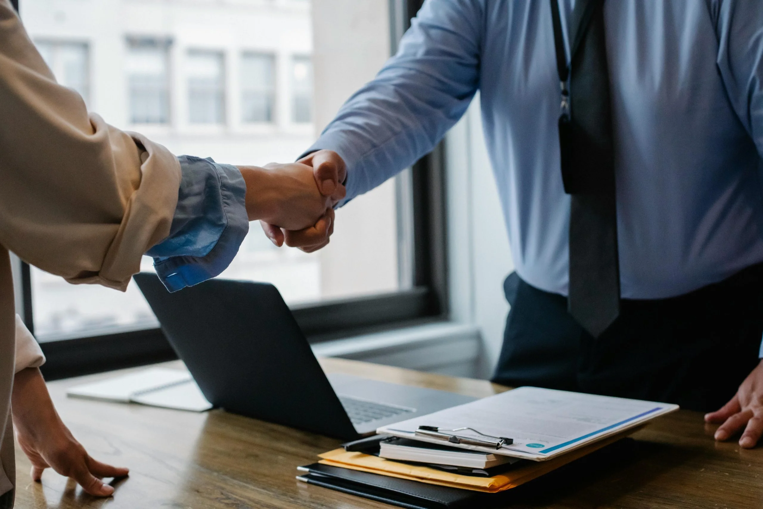 Funding Round staff handshaking for a client close deal